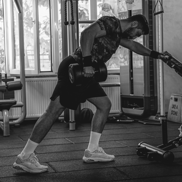 Man performing a dumbbell row exercise